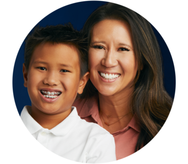 Smile Doctors by DN Ortho 185 month braces offer for New Orleans area residents | mother and son with braces smiling
